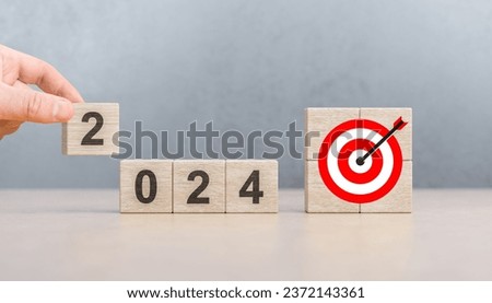 2024 goals of business. Wooden cubes with 2024 and goal icon. Starting 2024 new year. Business common goals for planning new project, annual plan, business target achievement. Royalty-Free Stock Photo #2372143361