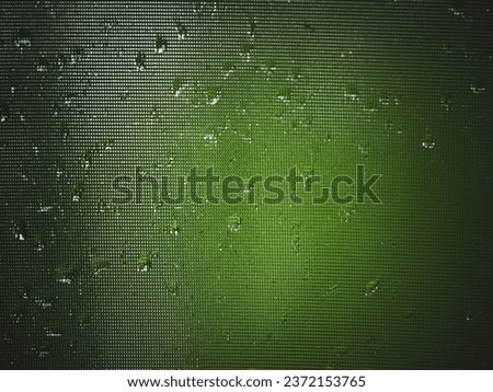 Water droplets on window, green tone for dark background