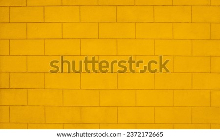 Vintage yellow brick wall texture background.
