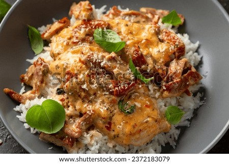 Marry Me Chicken. Creamy Garlic Sun Dried Tomato Chicken with rice. Healthy food Royalty-Free Stock Photo #2372183079