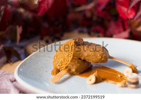 Magnum ice creams dessert made from white chocolate mousse, carmel and nuts Royalty-Free Stock Photo #2372199519