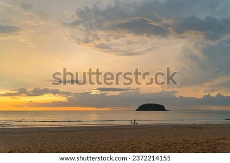 
Amazing beautiful golden sunset above the ocean.
cloud moving in nature cloudscape sky of sunset over the sea.
Scene of Colorful romantic sky sunset with gold color of the sky background.