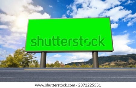 Big empty billboard with green screen outdoors with highway.