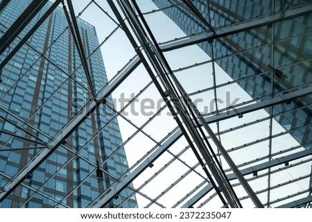 Modern futuristic steel structures between skyscrapers in the city center
