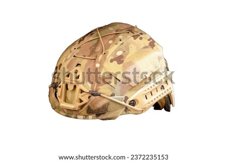 The soldier's helmet, part of the khaki military uniform, is present in the military clothing store, isolated on white background.