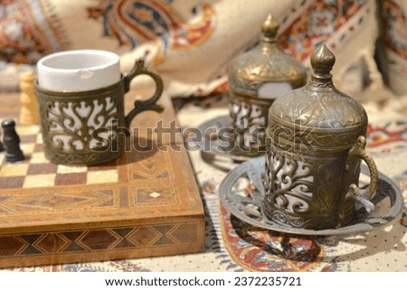 Turkish checkers, copper tableware, pewter tableware, Turkish coffee pot, cups, tea sets and Turkish coffee, coffee beans