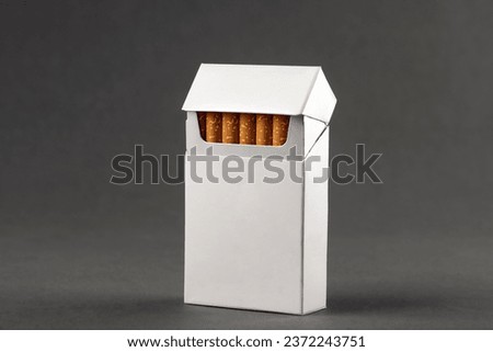 cigarette pack mockup ,
white cigarette box on gray background for design Royalty-Free Stock Photo #2372243751