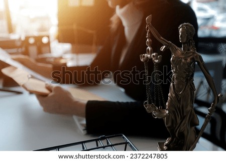 Male lawyer working with contract papers and wooden gavel on tabel in courtroom. justice and law ,attorney, court judge, concept. Royalty-Free Stock Photo #2372247805