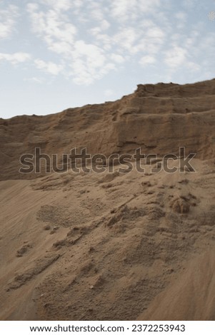 Canyons of sand on a construction heap for construction