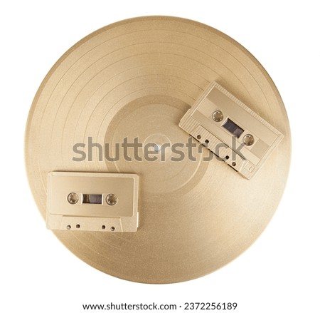 Vintage audio cassette and vinyl record isolated on white background. Clipping path included.