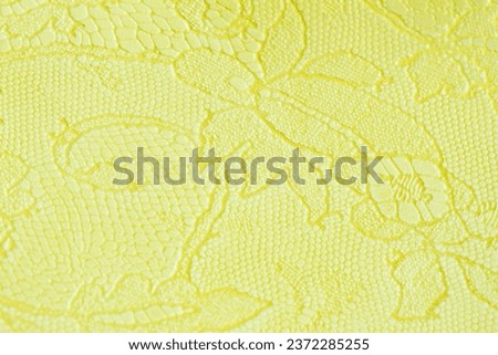 Genuine leather with an abstract ornament, tender light green color. Closeup on a leather texture