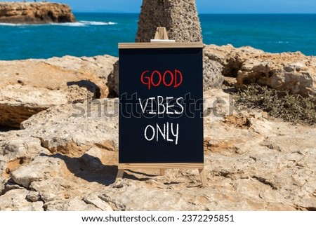 Good vibes only symbol. Concept word Good vibes only on beautiful black chalk blackboard. Beautiful stone beach sea blue sky background. Business motivational good vibes only concept. Copy space.