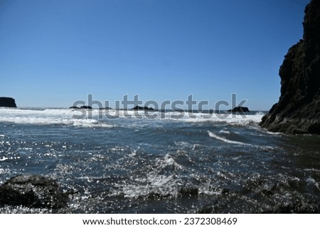 huge rocks on a beautiful Pacific ocean beach in lower Oregon
