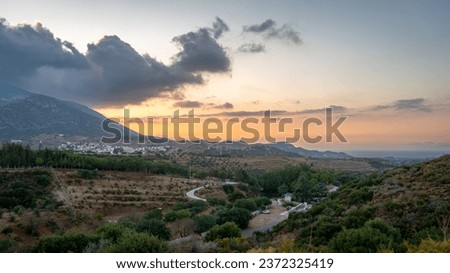 aerial mountain view landscape farmland, maquis and forest at sunset, wide angle view of village from above aegean europe 