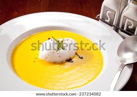 Delicate and Airy Cream Soup with Whipped Cream and Aromatic Spices. Photo, picture