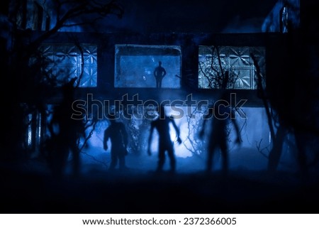 Silhouette of person standing in the dark forest with light. Horror halloween concept. strange silhouette at abandoned building