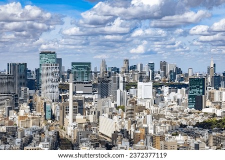 Blue sky, clouds, and buildings in Tokyo