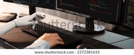 Program coding automation by generative artificial intelligence or AI concept. Collaboration between robotic hand and human software developer solving, debugging or writing script.Trailblazing Royalty-Free Stock Photo #2372381633