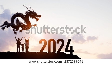 Silhouette of celebrating family and a dragon. 2024 New Year concept. New year's card 2024. Wide angle visual for banners or advertisements.