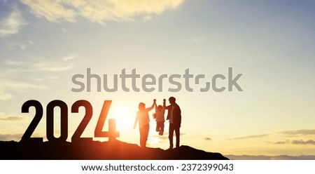 Silhouette of walking family. 2024 New Year concept. New year's card 2024. Wide angle visual for banners or advertisements.