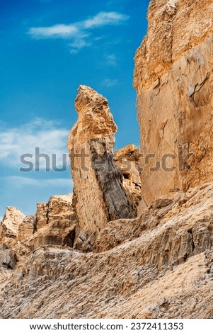 Lot's wife pillar of Salt; Mount Sodom on the south west of the Dead Sea in the Judean desert, Israel. In the book of Genesis Lot’s wife became a pillar of salt after she looked back at Sodom. Royalty-Free Stock Photo #2372411353