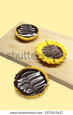 Pie Susu or milk pie on wooden tray, high angle view