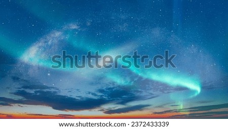 Our galaxy is Milky way spiral galaxy with aurora borealis Andromeda galaxy in the background "Elements of this image furnished by NASA" Royalty-Free Stock Photo #2372433339
