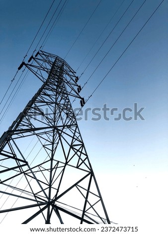 Sute tower electric high voltage blue sky tower sutet indonesia frog eye view angle Royalty-Free Stock Photo #2372473715