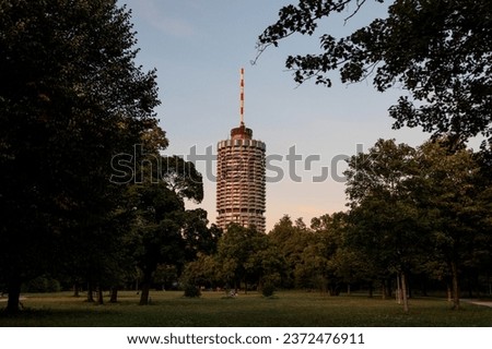 Hotel tower in Augsburg popularly called corncob in Wittelsbacher Park on a summer evening with evening glow Royalty-Free Stock Photo #2372476911