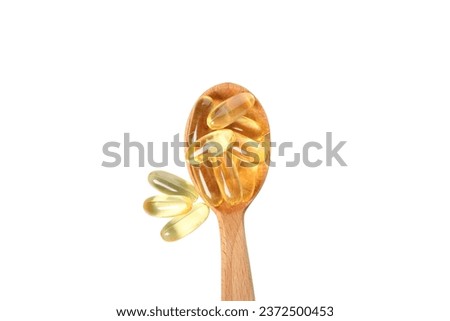 PNG,Wooden spoon with omega pills, isolated on white background