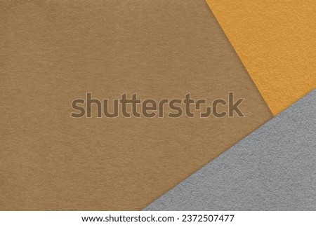Texture of craft brown color paper background with yellow and gray border. Vintage abstract ocher cardboard. Presentation template and mockup with copy space. Felt backdrop closeup.