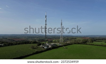Beacon Hill, Torbay, South Devon, England: DRONE VIEW: A transmission station with joint television and radio towers. The towers broadcast programmes in the popular holiday resort of Torbay. Royalty-Free Stock Photo #2372534959