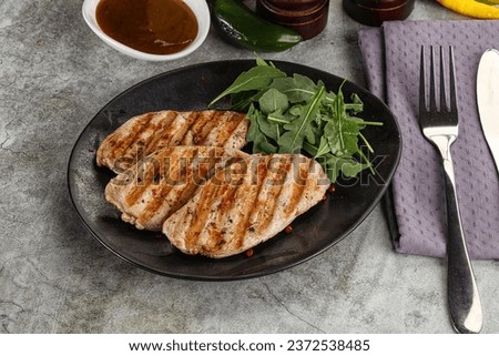 Grilled turkey breast fillet steak served arugula
