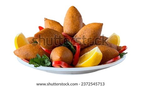 Stuffed meatballs. Kibbeh or Stuffed meatballs isolated on white background. Middle Eastern cuisine flavors. local name icli kofte Royalty-Free Stock Photo #2372545713