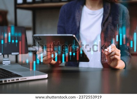 Trading growth graph on business and investment and finance business analysis stockmarket with digital tablet.digital technology background. in office

