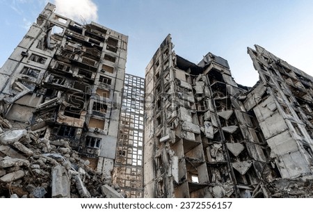 destroyed and burned houses in the city during the war in Ukraine Royalty-Free Stock Photo #2372556157