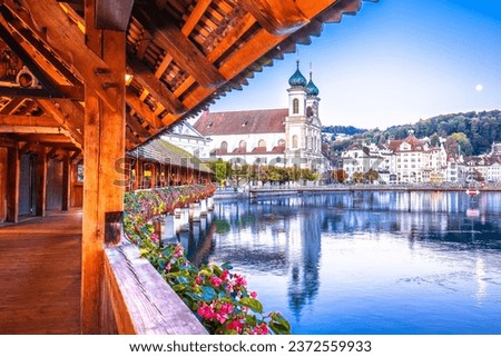Chappel bridge historic wooden landmark in Luzern and town riverfront view, town in central Switzerland Royalty-Free Stock Photo #2372559933