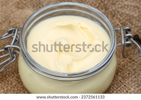 Creamy Homemade beef tallow glass , close-up  Royalty-Free Stock Photo #2372561133