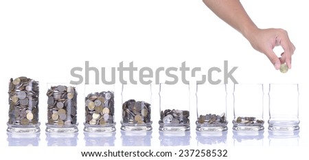 Financial education concept with hands putting coins isolated on white background