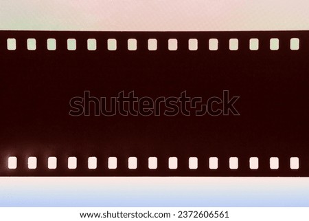 Abstract Filmstrip texture with dust and scratche on colorful background. Photo, movie, cinema concept, copy space