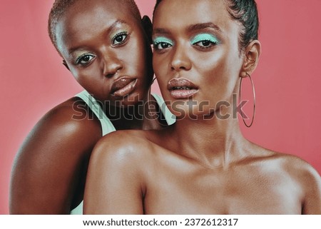 Makeup art, women together and portrait in studio, beauty or cosmetic for diverse friends by background. Creative black woman, model girl and neon color for support, skin glow or futuristic aesthetic