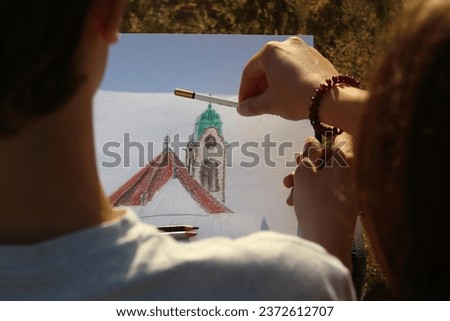 the teacher teaches the student to draw perspective on the picture