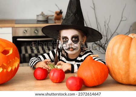 Little girl celebrating Halloween at home