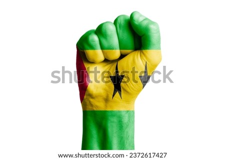 Man hand fist of Sao Tome and Principe flag painted. Close-up