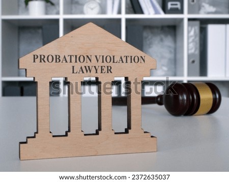 Desk with a plate probation violation lawyer. Royalty-Free Stock Photo #2372635037