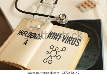 Influenza A H1N1 Virus is shown using the text in a book Royalty-Free Stock Photo #2372638149
