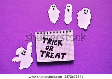 ghosts on the purple background -  Trick or treat Halloween backgrouns 