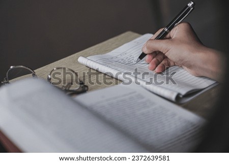 Closeup of girl writing on her journal