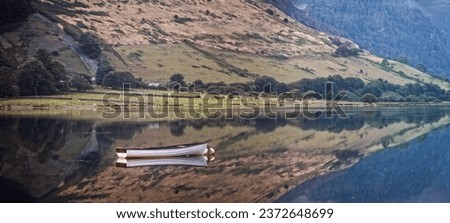 The lake of Tal-y-Llyn in south Snowdonia, at Tywyn near Cader Idris mountain Royalty-Free Stock Photo #2372648699