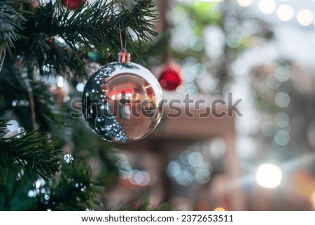 Christmas ball decorate on luxury pine tree branch night light bokeh blurred background scene happy new year